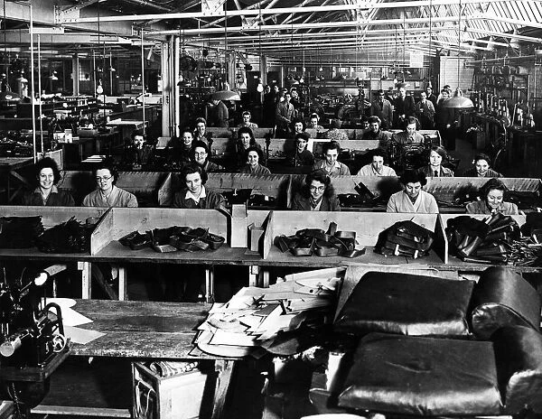 Women at work in a factory sewing leather products. Speke, Liverpool, 8th January 1946