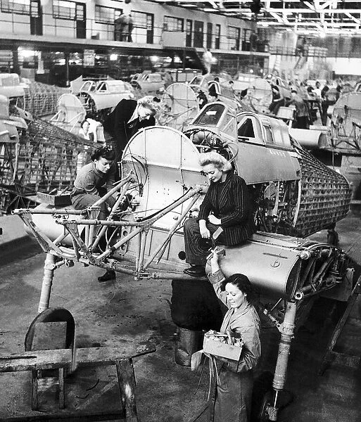 Women work on the production line of Hawker Hurricane aircraft during WW2