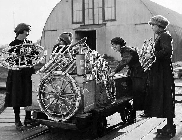 Women workers loading a box at Brocks fireworks factory in Sutton