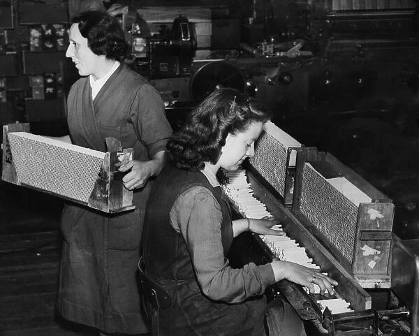 Women working on a cigarette production line. Cigarettes being manufactured at the rate