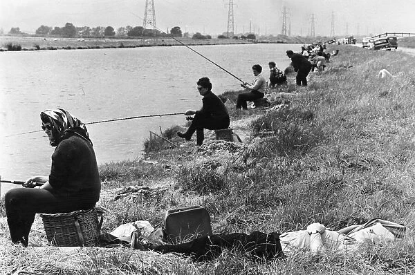 Womens angling competiton July 1966 Her husband catches up on 40 winks as his