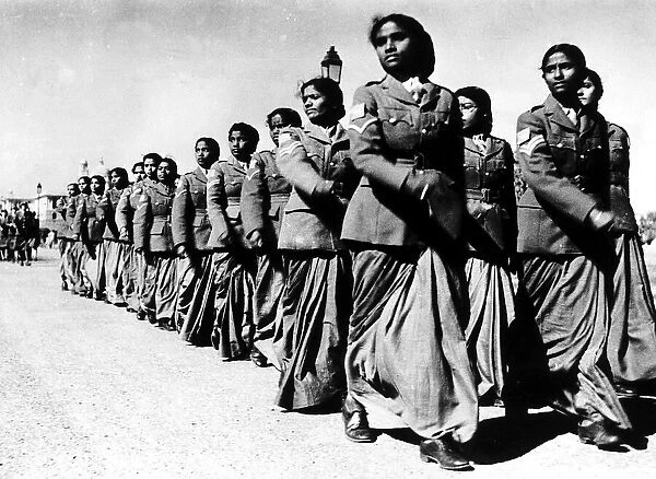 Womens auxiliary corps march past one of the army platoons