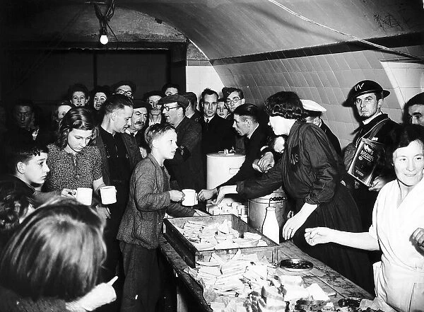 Womens Voluntary Service serve tea and sandwiches to people sheltering from German