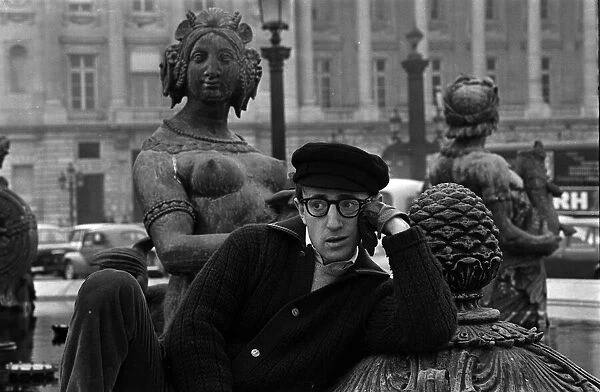 Woody Allen poses with The Tritons and Nereids in the fountains at Place de la Concorde