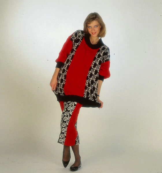 Woollens fashion, November 1985 Female model wearing red woollen tunic with top