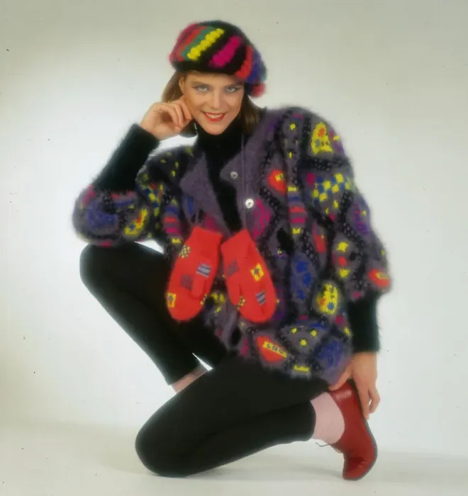 Framed Print : Woollens fashion, November 1985 Female modelling multi-coloured cardigan gloves Framed Print : Woollens fashion, November 1985 Female modelling multi-coloured cardigan gloves