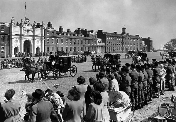 Woolwich: General view showing horses walking between ranks of cheering troops