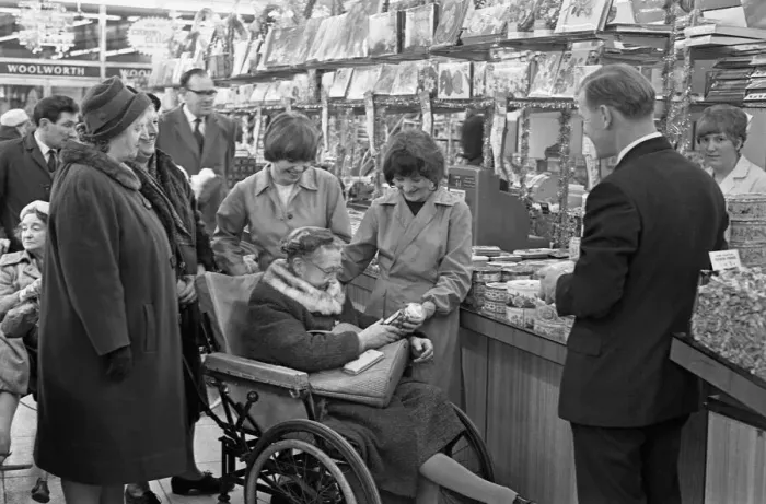 Framed Print : Woolworths, Rugby. Staff stay on to assist disabled shoppers with their Christmas