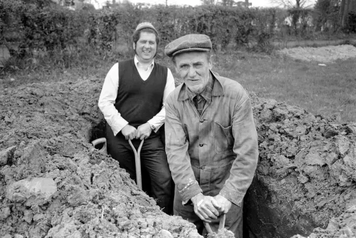 Framed Print : Is work wonderful?. Feature. Grave Diggers at work in the grave yard of Windlesham Church