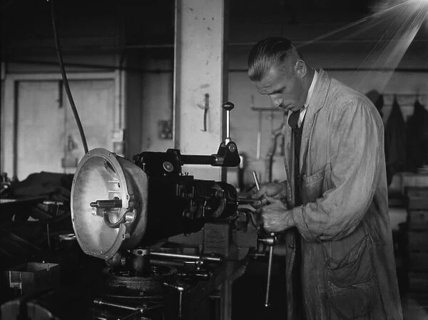 Worker assembling a gearbox in the Triumph car factory in Coventry. 23rd September 1931
