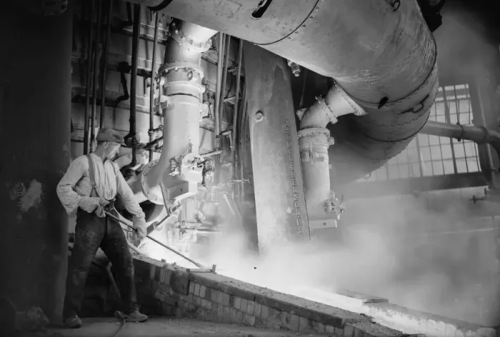 Framed Print : A worker checks the molten metal at the new one million pound furnace at Ford Framed Print : A worker checks the molten metal at the new one million pound furnace at Ford