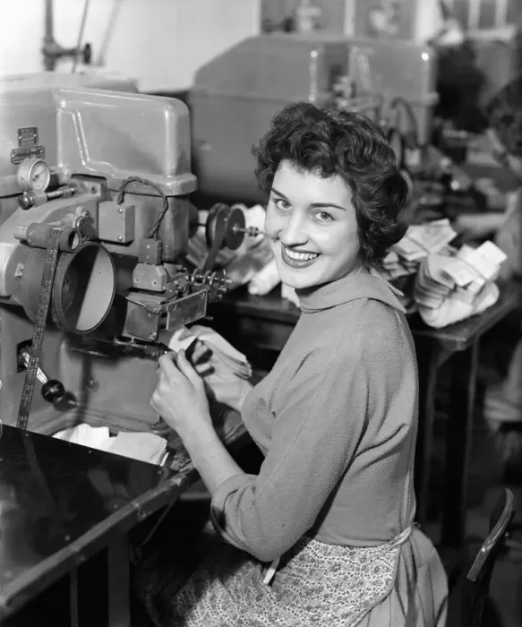 Framed Print : Worker at the Mansfield shoe factory in Northampton operating a labelling machine Framed Print : Worker at the Mansfield shoe factory in Northampton operating a labelling machine