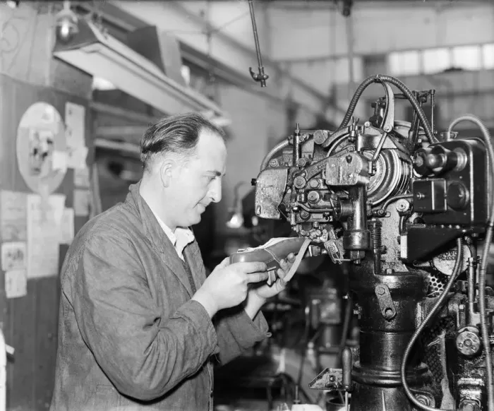Framed Print : A worker at the Mansfield shoe factory in Northampton stitching a leather upper before Framed Print : A worker at the Mansfield shoe factory in Northampton stitching a leather upper before