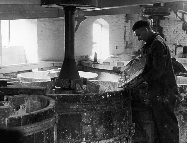 A worker at the Minton China Works in Stoke On Trent, pictured in the mill
