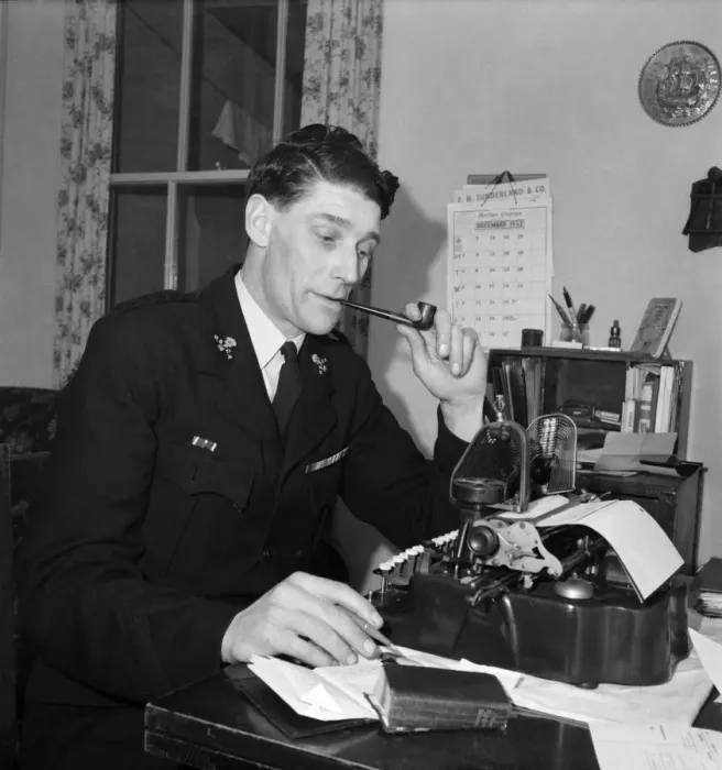 Framed Print : A worker for the RSPCA sitting at his desk typing his work and smoking a pipe Framed Print : A worker for the RSPCA sitting at his desk typing his work and smoking a pipe