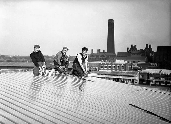 Workers fitting a new roof at Lords Cricket Ground. 21st May 1957