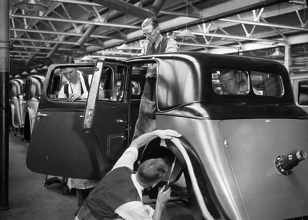 Workers on the Gloria assembly line in the Triumph car factory in Coventry