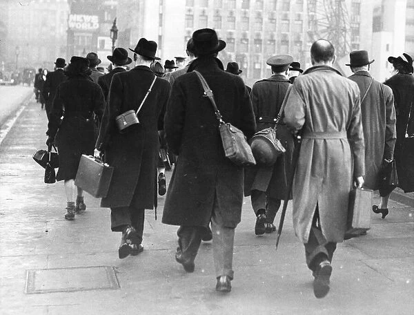 Workers going to work. City of London. They care carrying there tin helmets incase