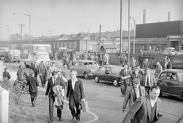 Workers leave Longbridge motor plant in Birmingham after a car delivery on the last day