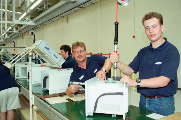 Framed Print : Workers on the pilot production line at the new Samsung factory Wynyard
