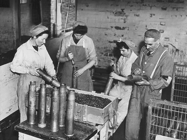 Workers at the Royal Ordinance factory at Chorley in Lancashire destroy shells at the end