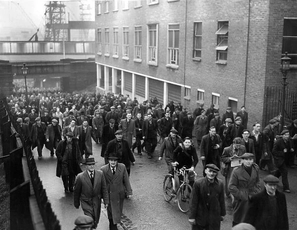 Workers from at Swan Hunter shipbuilders in Wallsend leave after a shift