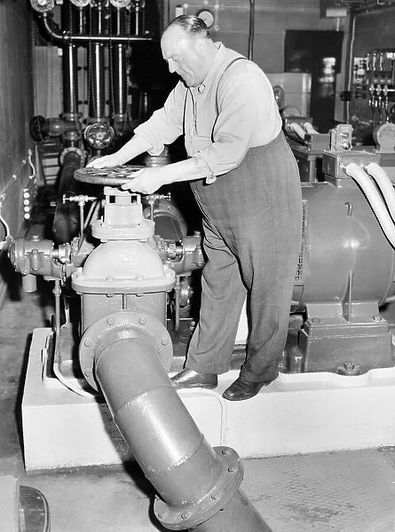 Workman: Man who turns on the pumps for the Trafalgar Square fountains. 1957 A88-007