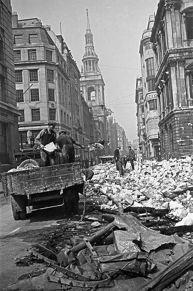 Workmen clear rubble from the Cheapside, City of London, the spire of St Mary-le-Bow