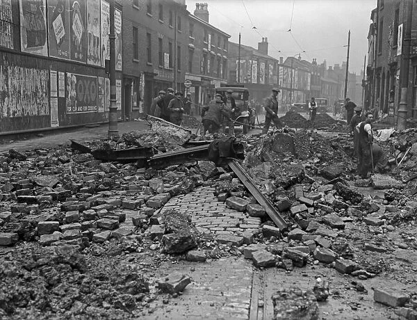 Workmen clearing the damaged tram lines in Moseley Road, Balsall Heath, Birmingham