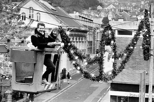 Workmen put the finishing touches to Christmas decorations, Swansea, Wales