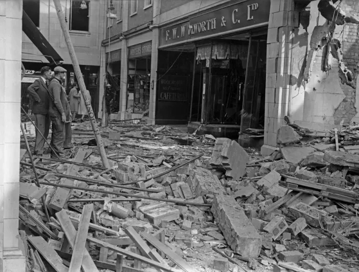 Framed Print : Workmen inspect the damage to F W Woolworth and The Arcade in Coventry following a raid Framed Print : Workmen inspect the damage to F W Woolworth and The Arcade in Coventry following a raid