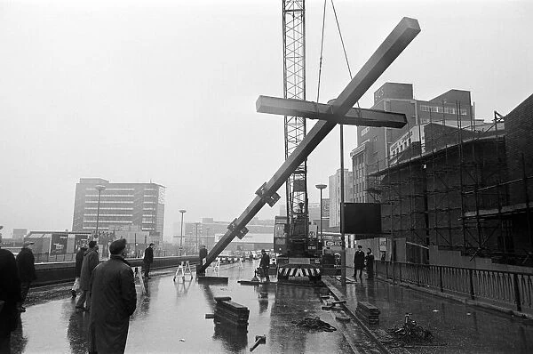 Workmen moving Britains tallest free-standing cross into position at Carrs Lane