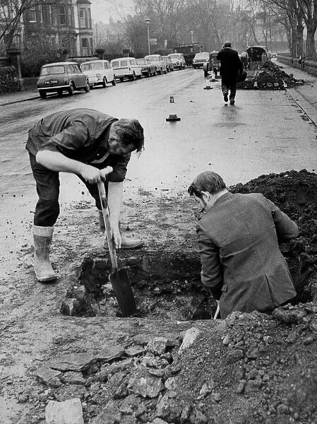 Workmen open up the road in Brandling Park, Jesmond, Newcastle