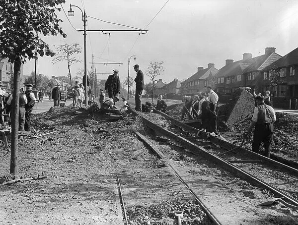 Workmen repair the tramlines at Tyburn Road, Birmingham following an air raid on the city