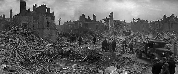 Workmen and rescue squads search the shattered remains of Queens Road, Aston, Birmingham