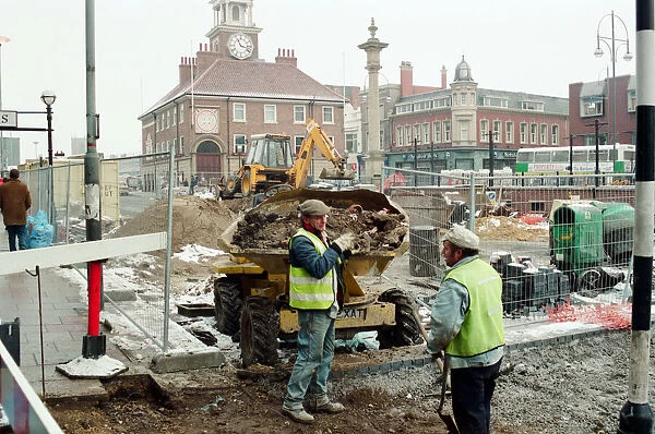 Workmen try to beat the freezing weather, before daytime work on Stockton High Street