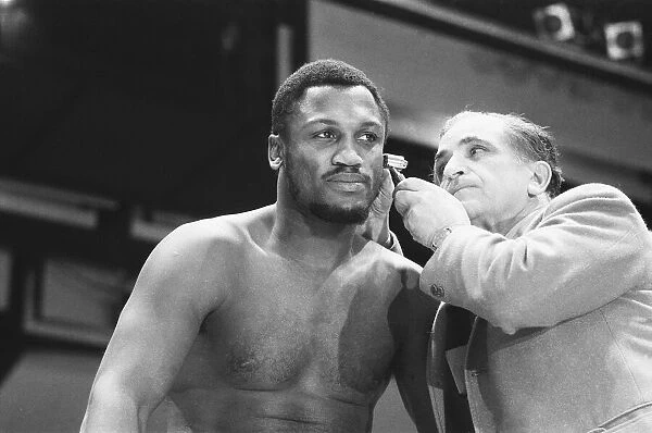 World Champion Joe Frazier (left) seen here being examined at the pre fight medical for