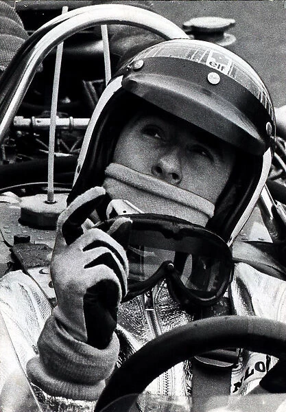 Former World Champion racing driver Jackie Stewart in a car cockpit during his driving