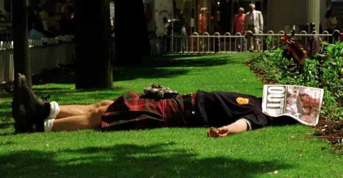 Framed Print : World Cup France June 1998 Scotland fan asleep lying in St Etienne garden with Daily