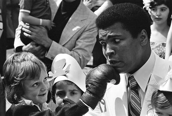 World Heavy-weight boxing champion, Muhammad Ali presented a coach on behalf of