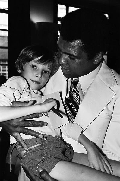 World heavyweight boxing champion Muhammad Ali presented a sunshine coach on the behalf