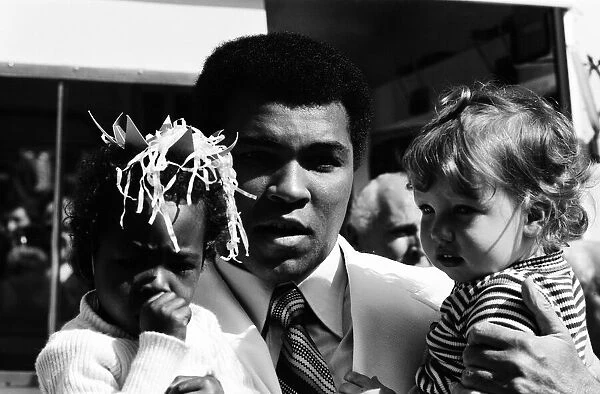 World heavyweight boxing champion Muhammad Ali presented a sunshine coach on the behalf