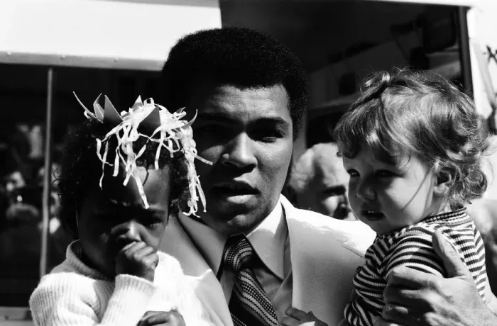Framed Print : World heavyweight boxing champion Muhammad Ali presented a sunshine coach on the behalf