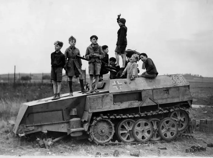 Framed Print : World War 2 1944 Children play on a knocked out German half track armoured vehicle Framed Print : World War 2 1944 Children play on a knocked out German half track armoured vehicle