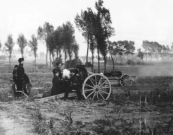 World War One - Belgian artillery in action as they fire their field guns 1914