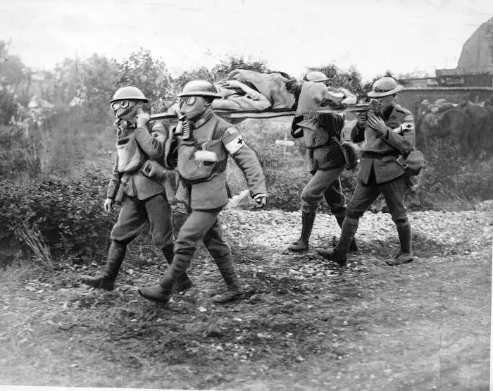 Framed Print : World War One - Canadian Medical Corp with wounded on stretcher wearing gas masks. 1918 Framed Print : World War One - Canadian Medical Corp with wounded on stretcher wearing gas masks. 1918