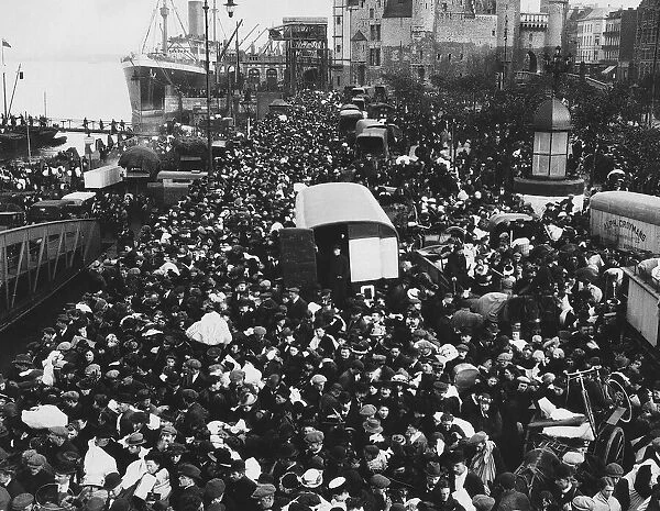 World War One - Canadian troops board ships at Antwerp to return home watched by