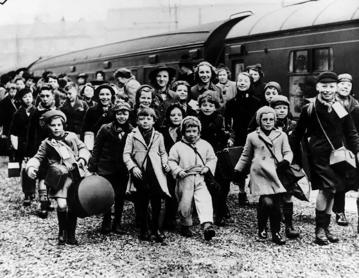 Framed Print : World War Two Children evacuated from the cities disembark from a train in the West Framed Print : World War Two Children evacuated from the cities disembark from a train in the West