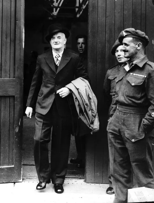 Framed Print : World War Two - Discharged soldier leaving clothes store wearing his demob clothes June Framed Print : World War Two - Discharged soldier leaving clothes store wearing his demob clothes June