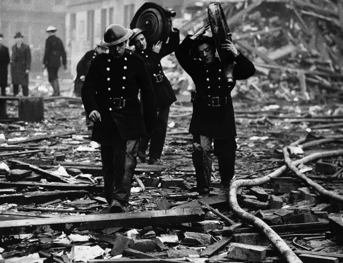 Framed Print : World War Two Firemen carry their hoses through the rubble after an air raid Framed Print : World War Two Firemen carry their hoses through the rubble after an air raid